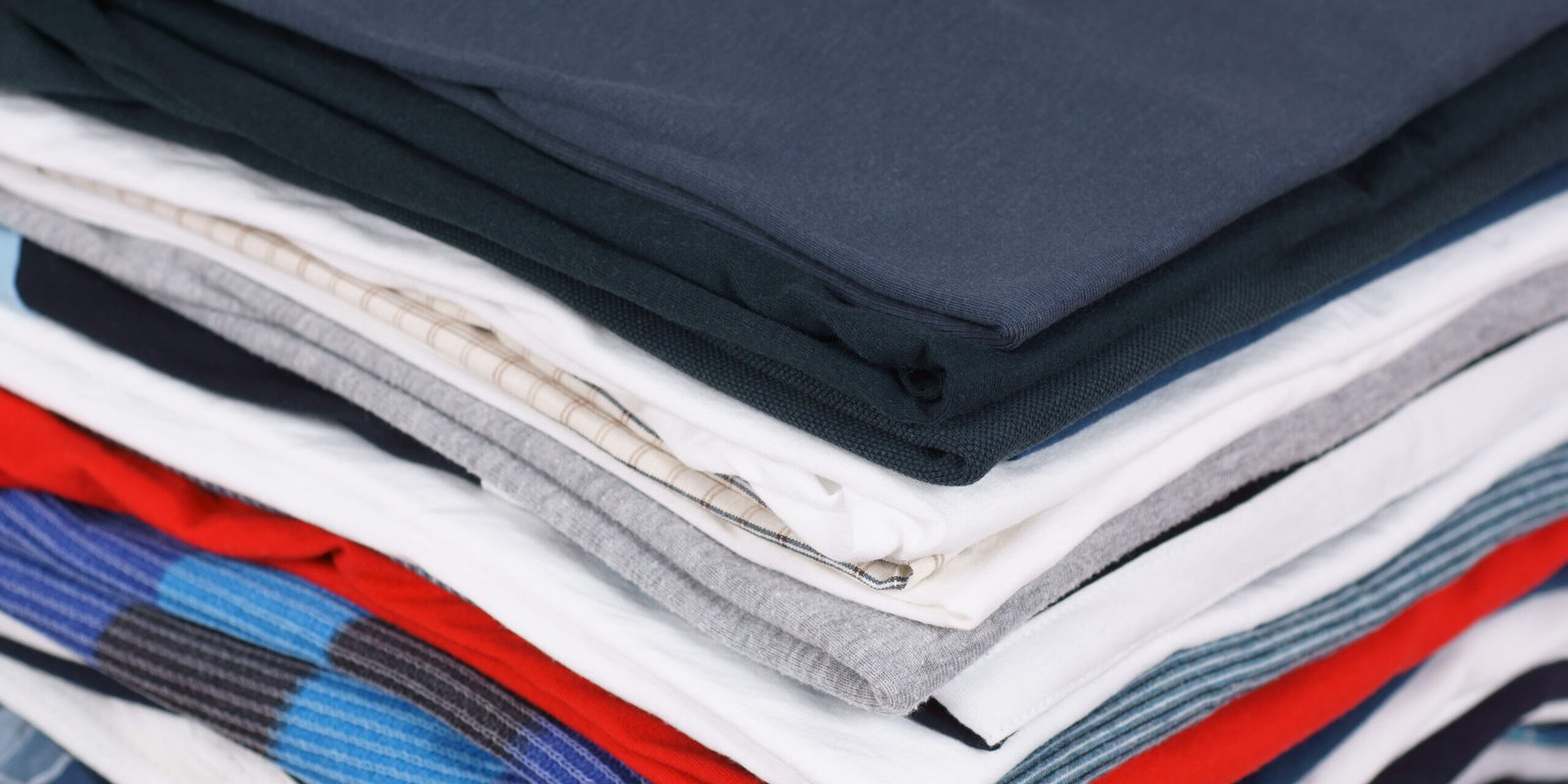 Pile of colorful clothes, stack of clothing